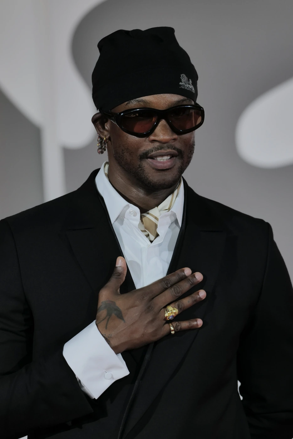Akinola Davies Jr. close-up portrait with hand on chest, Venice Film Festival 2026 – Ph. Barbara Pigazzi, Studio Animica