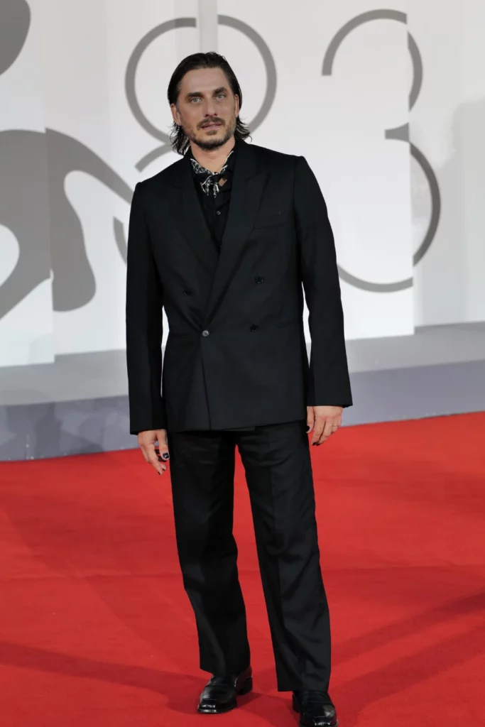 Luca Marinelli in black suit on the red carpet at Venice Film Festival 2026, Ph. Barbara Pigazzi, Studio Animica